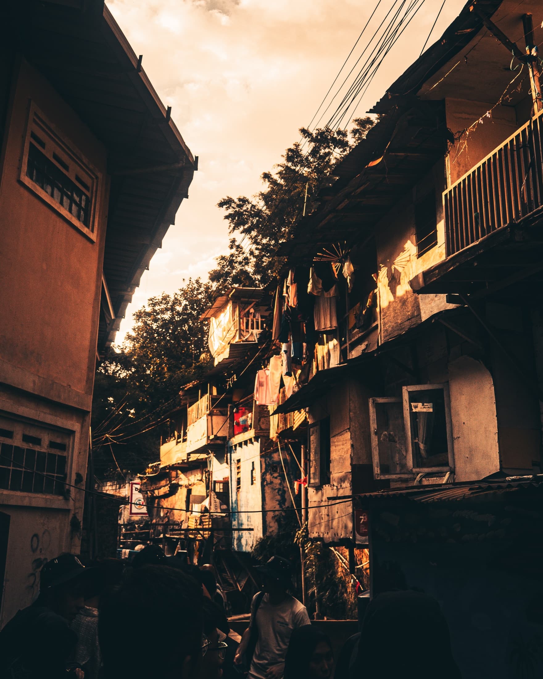Golden-hour street between homes