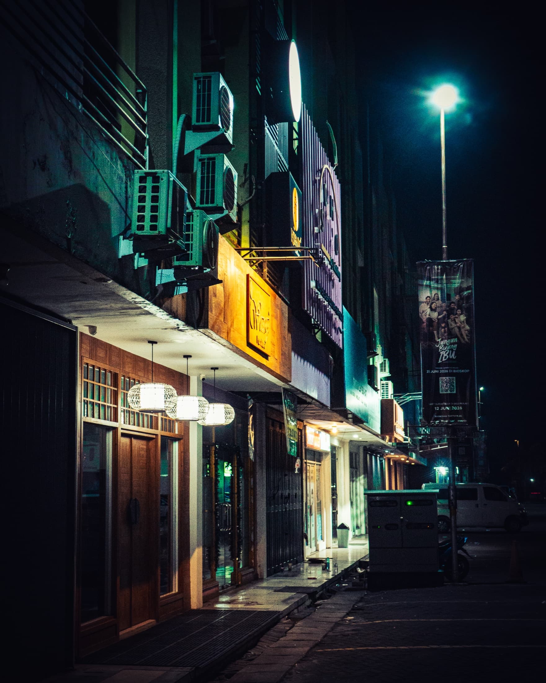 Neon-lit city alley at night